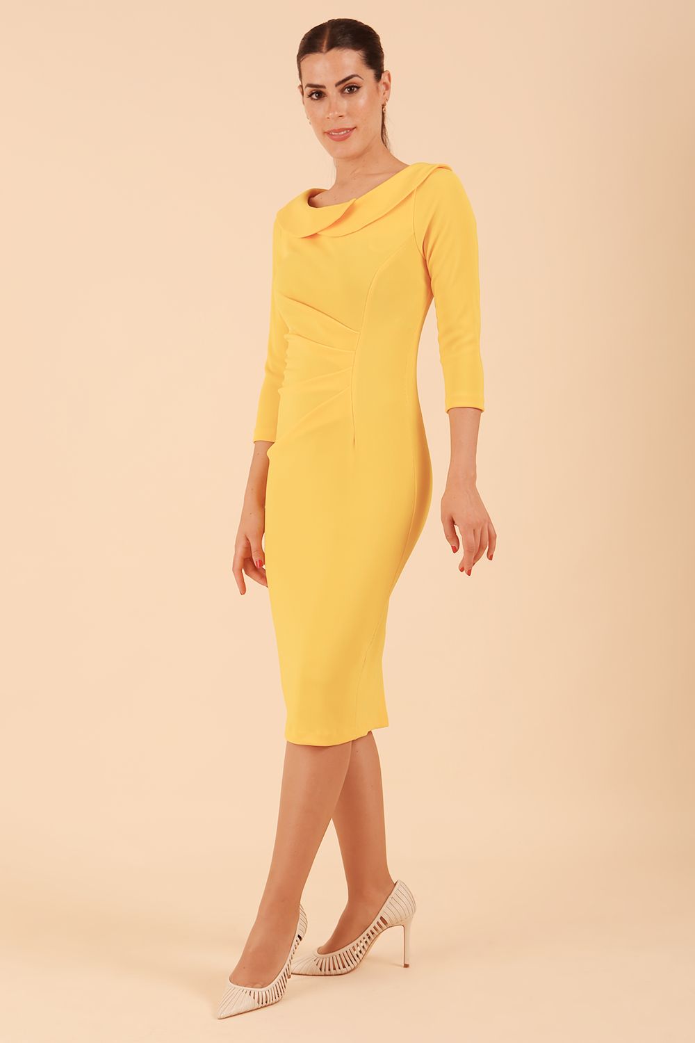 Model wearing diva catwalk Monique 3/4 Sleeve Pencil Dress with Overlapping Folded Round Neckline and 3/4 sleeves and knee length in Sunshine Yellow front