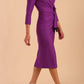 Model wearing diva catwalk Seed Elsye 3/4 Sleeve Knee Length Pencil Dress with Fold over bateau collar neckline with contrast piping and Bow feature on the left side of the bodice in Amethyst Purple colour front side