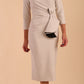 Model wearing diva catwalk Seed  Elsye 3/4 Sleeve Knee Length Pencil Dress with Fold over bateau collar neckline with contrast piping and Bow feature on the left side of the bodice in Sandy Cream colour front