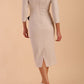 Model wearing diva catwalk Seed  Elsye 3/4 Sleeve Knee Length Pencil Dress with Fold over bateau collar neckline with contrast piping and Bow feature on the left side of the bodice in Sandy Cream colour back