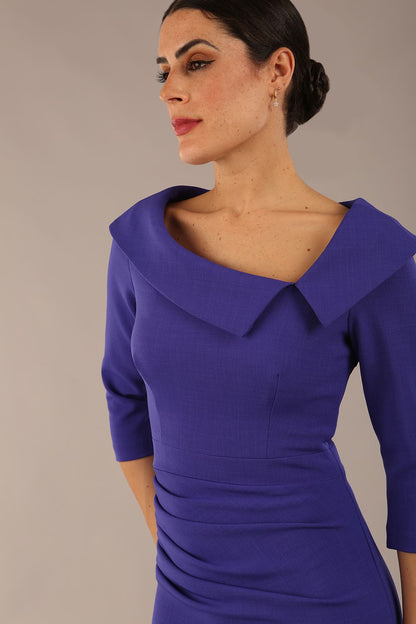 Model is wearing a diva catwalk Bentley 3/4 Sleeve Knee Length Pencil Dress in Indigo Blue colour