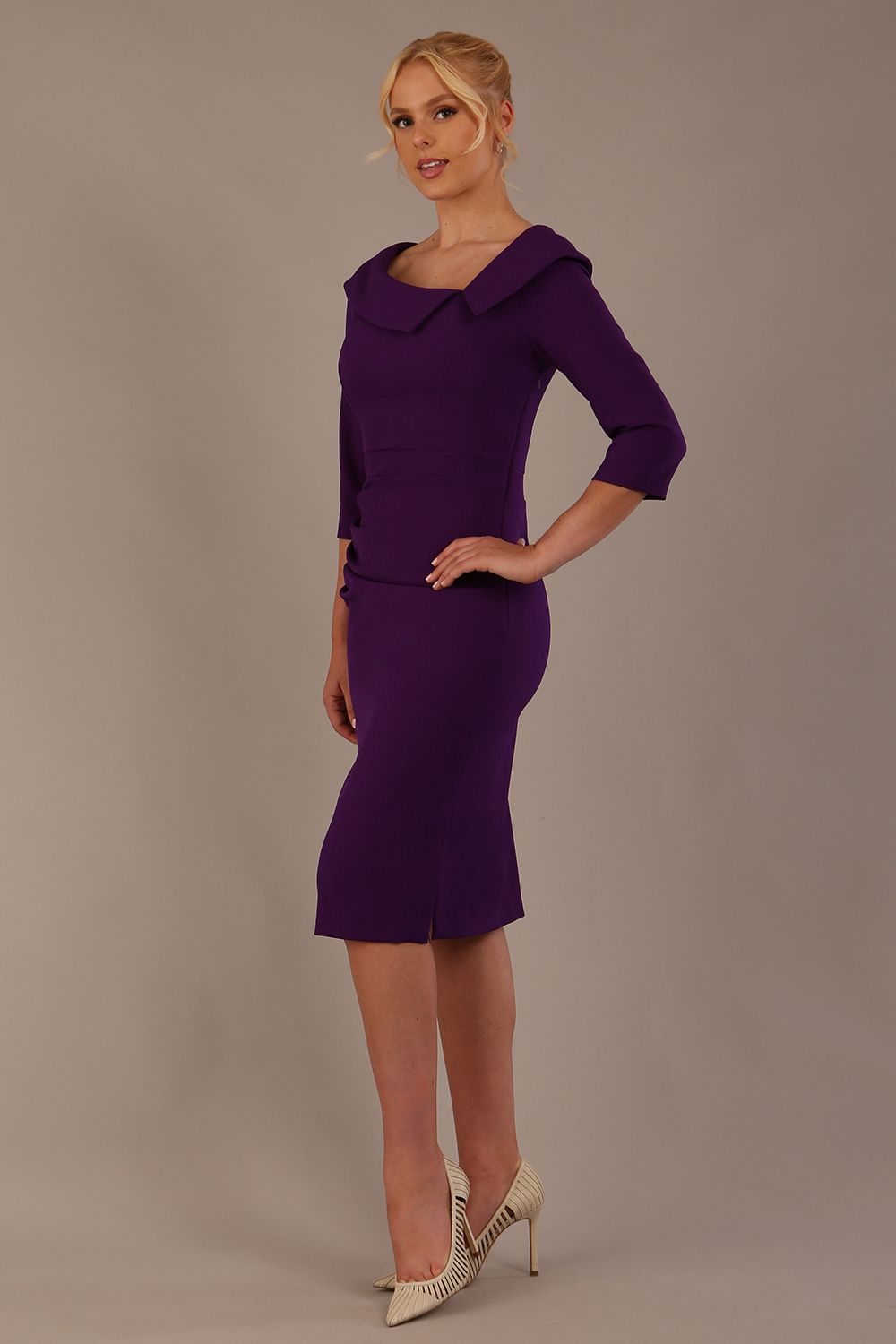 Model wearing diva catwalk Bentley 3/4 Sleeve Knee Length Pencil Dress in Deep Purple front