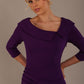 Model wearing diva catwalk Bentley 3/4 Sleeve Knee Length Pencil Dress in Deep Purple front close up