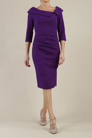 Model wearing diva catwalk Bentley 3/4 Sleeve Knee Length Pencil Dress in Deep Purple front