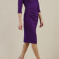 Model wearing diva catwalk Bentley 3/4 Sleeve Knee Length Pencil Dress in Deep Purple side