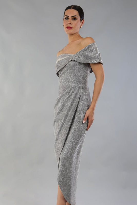 model is wearing diva catwalk unity glitter maxi dress with off shoulder bardot neckline and tulip design skirt in silver colour front