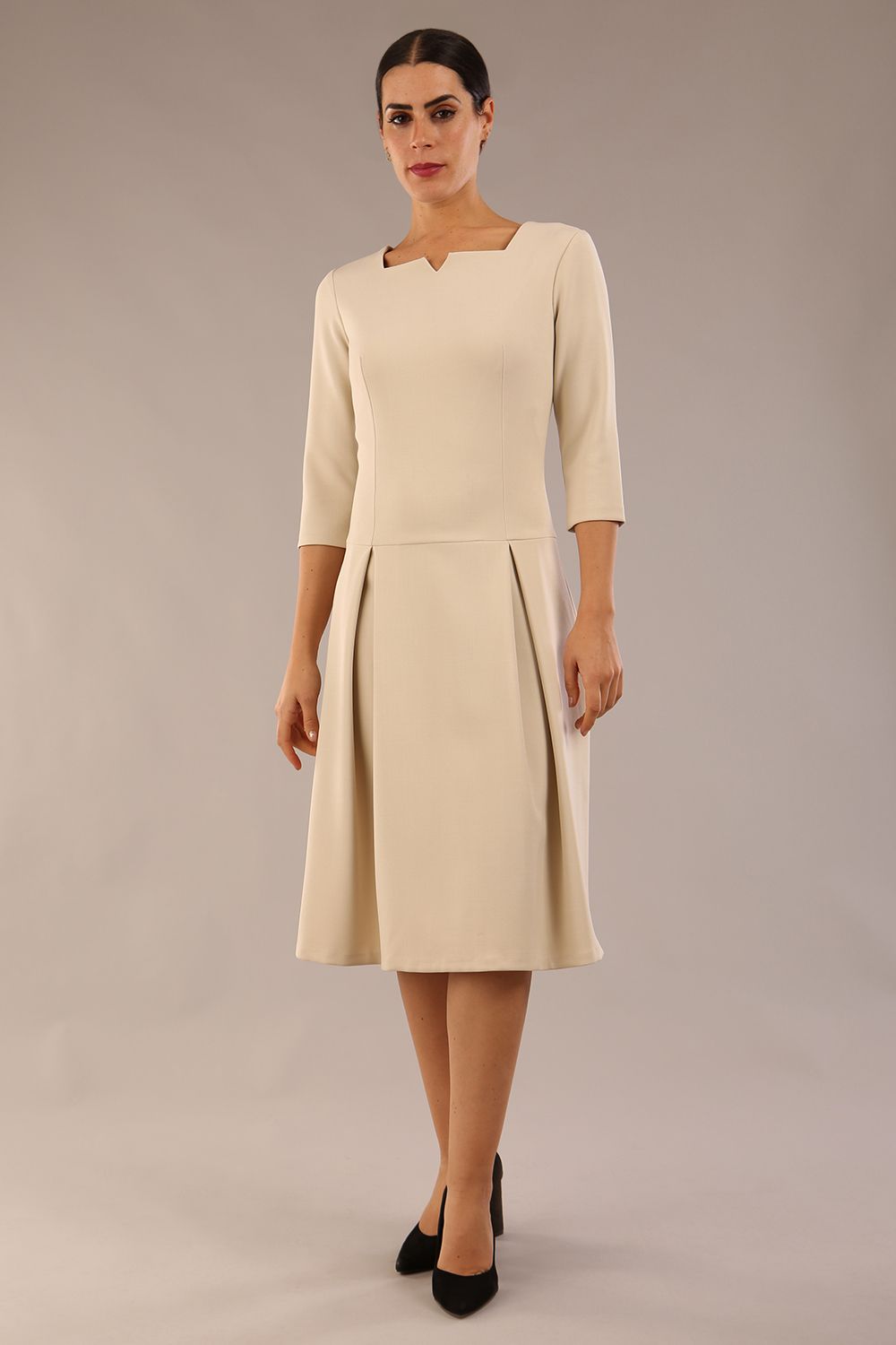 model is wearing a diva catwalk Cordelia Square Neck Pleated Midi A-line Dress with 3/4 sleeve in sandshell beige colour front