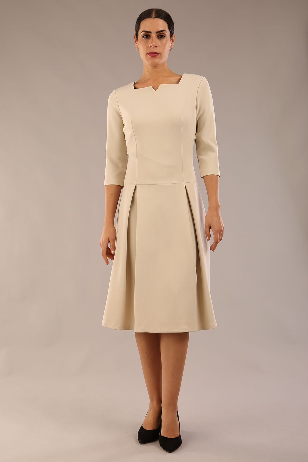 model is wearing a diva catwalk Cordelia Square Neck Pleated Midi A-line Dress with 3/4 sleeve in sandshell beige colour front