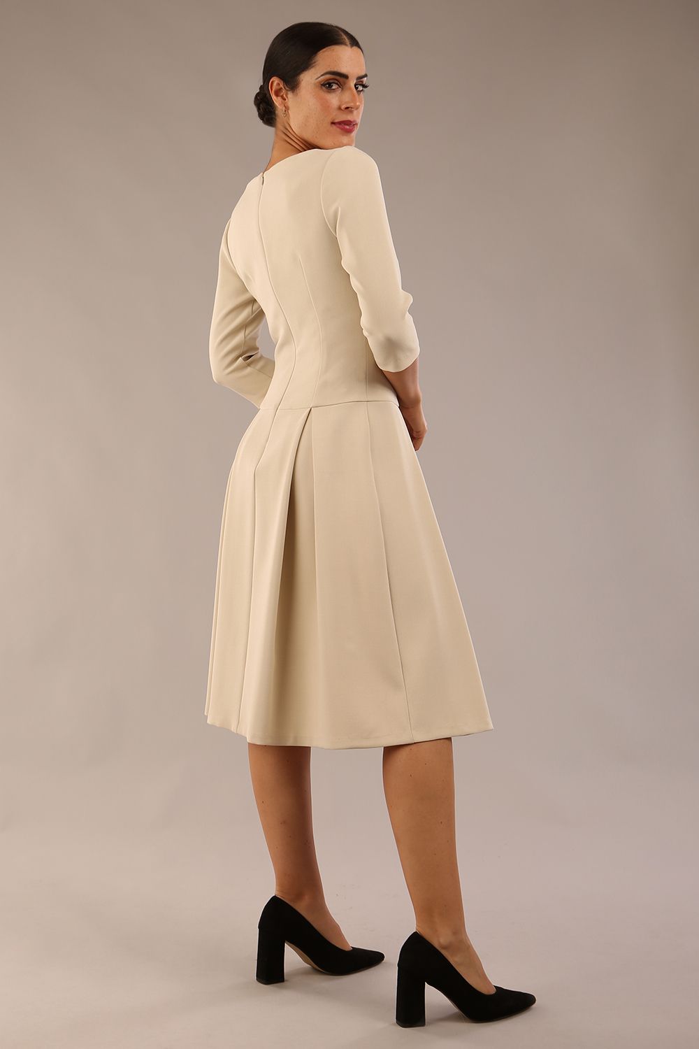 model is wearing a diva catwalk Cordelia Square Neck Pleated Midi A-line Dress with 3/4 sleeve in sandshell beige colour back