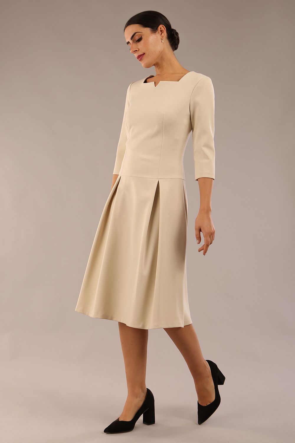 model is wearing a diva catwalk Cordelia Square Neck Pleated Midi A-line Dress with 3/4 sleeve in sandshell beige colour front