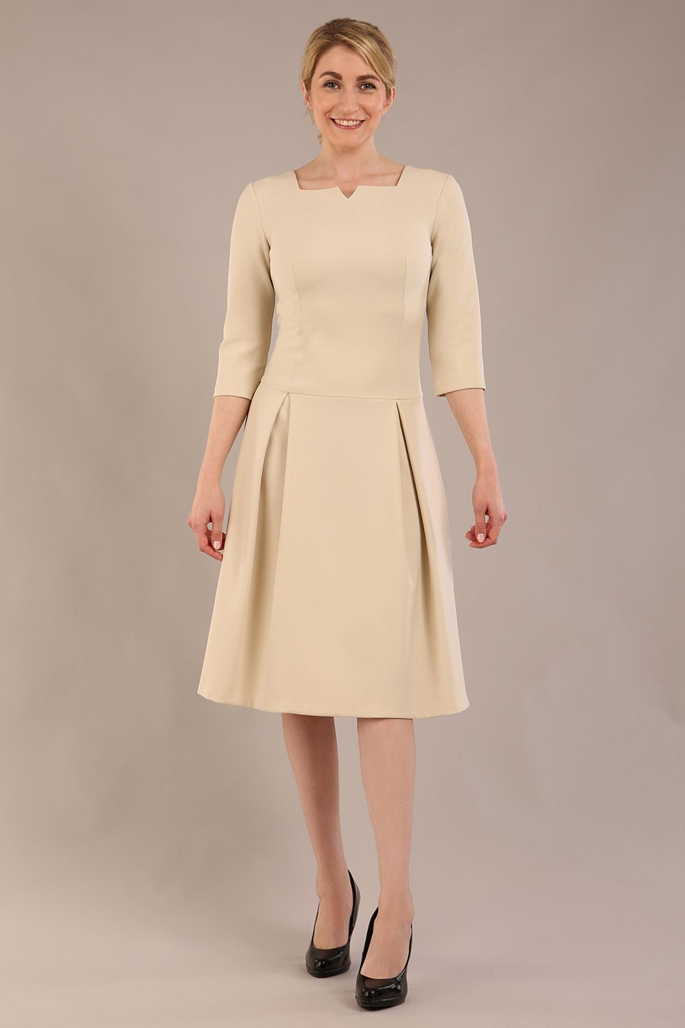 model is wearing a diva catwalk Cordelia Square Neck Pleated Midi A-line Dress with 3/4 sleeve in sandshell beige colour front