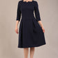 model is wearing a diva catwalk Cordelia Square Neck Pleated Midi A-line Dress with 3/4 sleeve in navy blue colour 