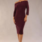 model is wearing a diva catwalk neptune pencil off-shoulder dress with 3/4 sleeve in burgundy sparkle front