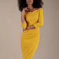 Model wearing diva catwalk Trixie dress against a beige background in (Sunrise Yellow)