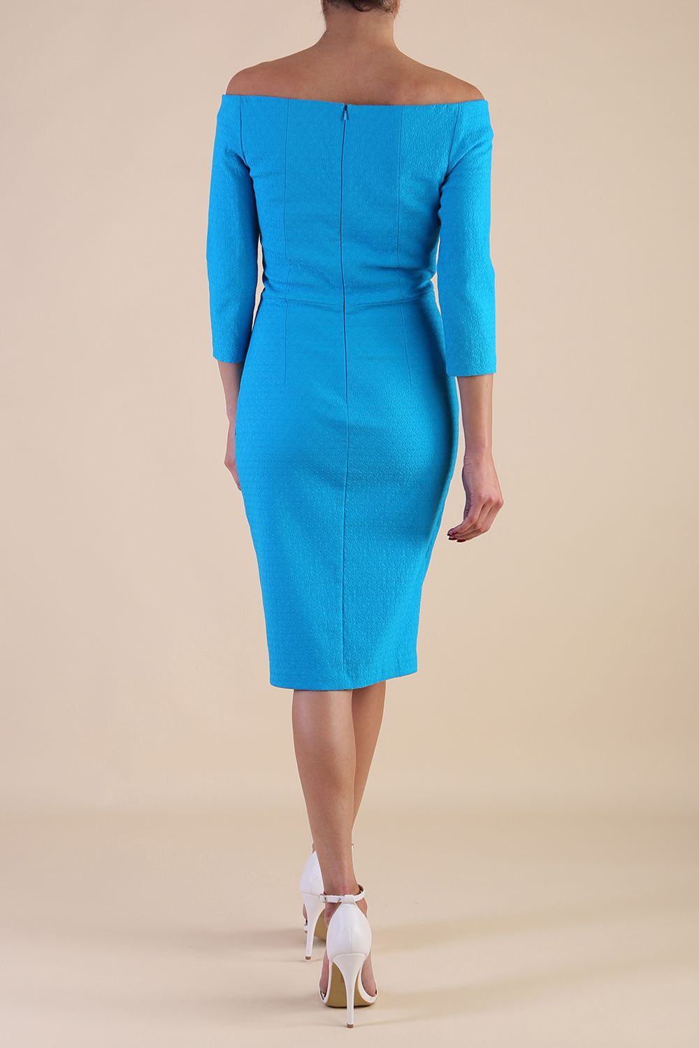 Model wearing diva catwalk Trixie dress in Turquoise Blue back