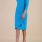 Model wearing diva catwalk Trixie dress in Turquoise Blue side