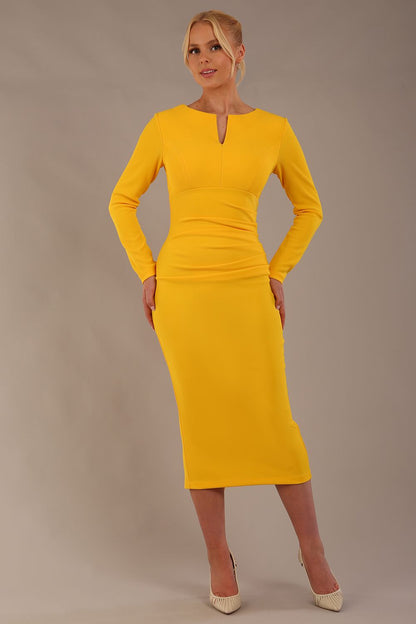 Model wearing diva catwalk Long Sleeved Lydia Midi pencil dress in Sunshine Yellow (Sunshine Yellow)