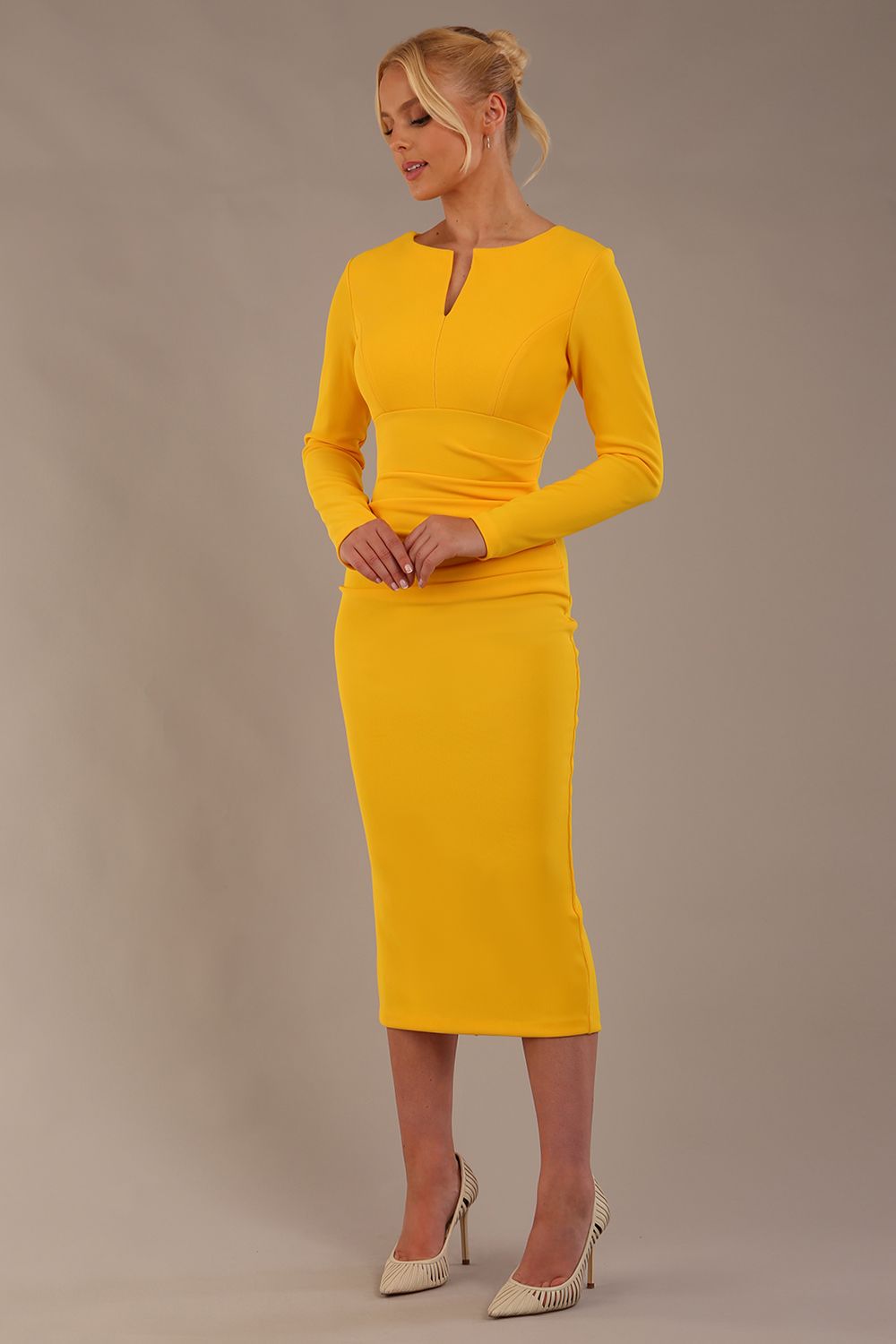 Model wearing diva catwalk Long Sleeved Lydia Midi pencil dress in Sunshine Yellow (Sunshine Yellow)