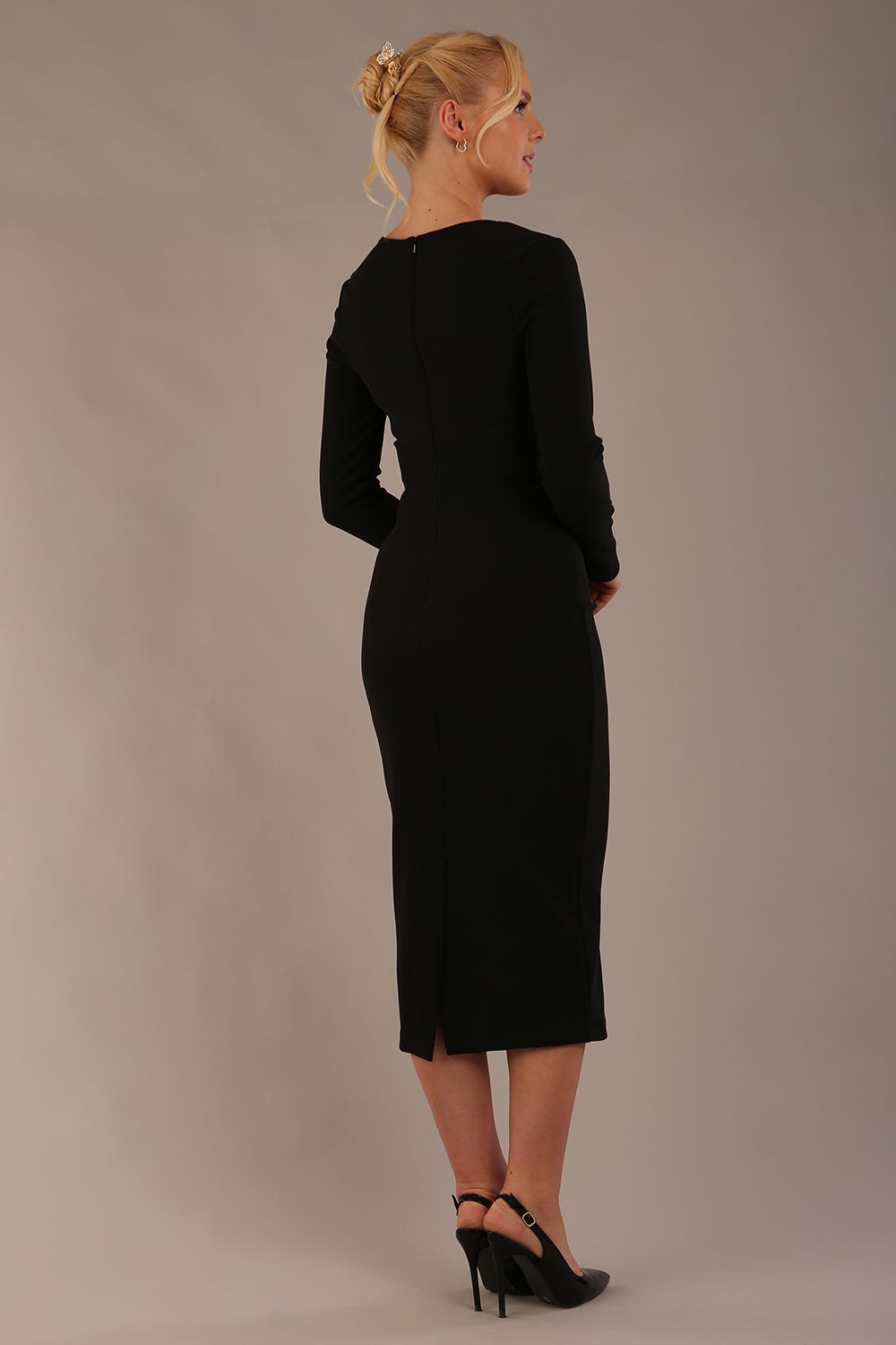 Woman wearing a diva catwalk black Long-Sleeved-Lydia-Midi-Pencil-Dress against a plain background (Black)