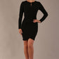 model wearing a diva catwalk lydia long sleeved pleated Mini Dress from Diva Catwalk in black in high heal shoes against a beige background