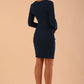 Image of model wearing a long sleeved pleased Mini Pencil Dress from Diva Catwalk in Teal in high heal shoes