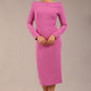 brunette Model is wearing a DIVA Catwalk Faye Off Shoulder Long Sleeve Midi Pencil Dress in Rosebud Pink colour front image