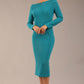 brunette Model is wearing a DIVA Catwalk Faye Off Shoulder Long Sleeve Midi Pencil Dress in Mosaic Blue colour front image