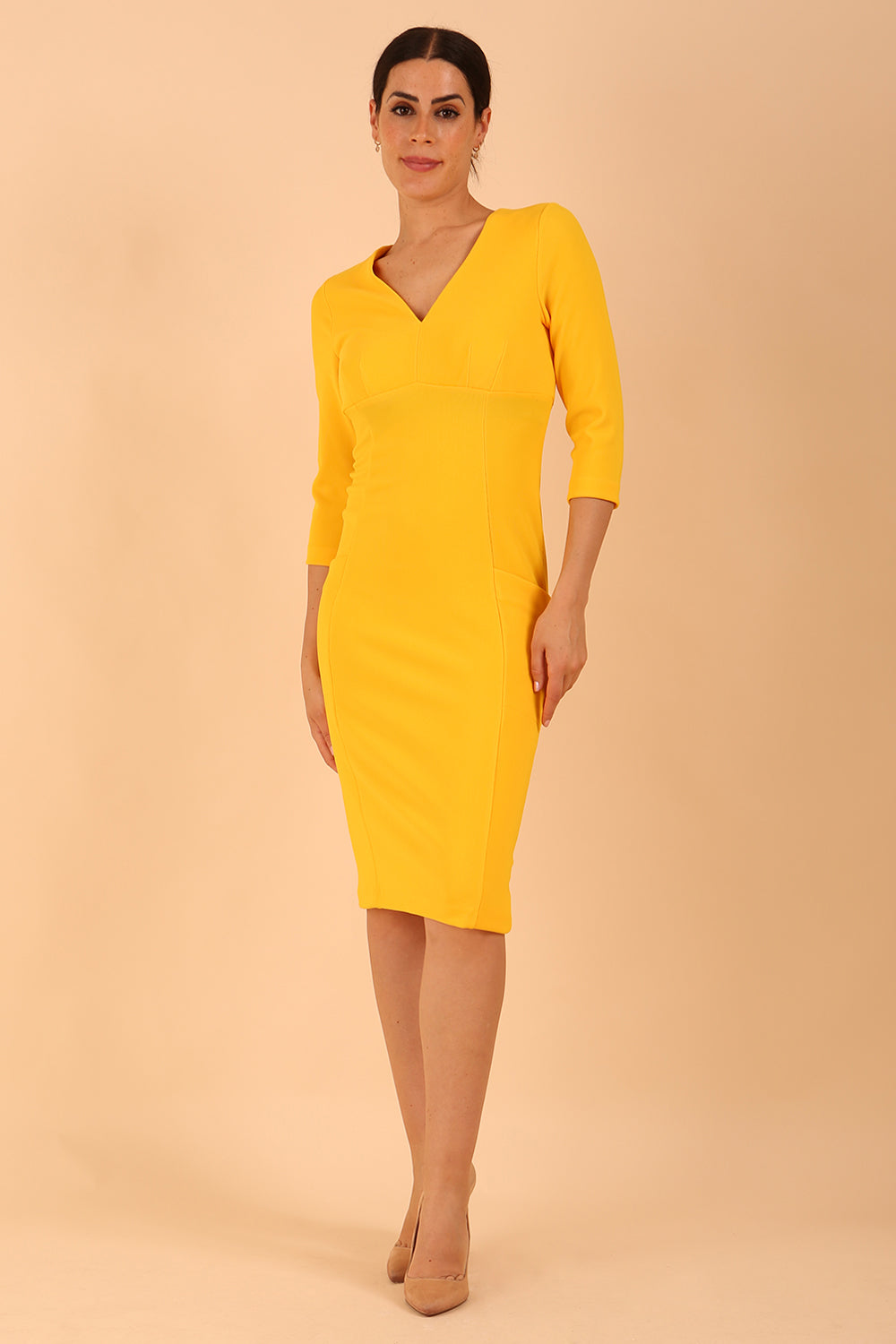 Model wearing diva catwalk Luna 3/4 Sleeved pencil skirt dress in Sunshine Yellow