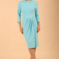 Model wearing diva catwalk Hazel pencil skirt dress with 3/4 sleeved in Turquoise