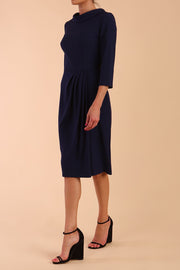 Model wearing diva catwalk Hazel pencil skirt dress with 3/4 sleeved in Navy Blue