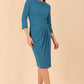 Model wearing diva catwalk Hazel pencil skirt dress with 3/4 sleeved in Tropical Teal side