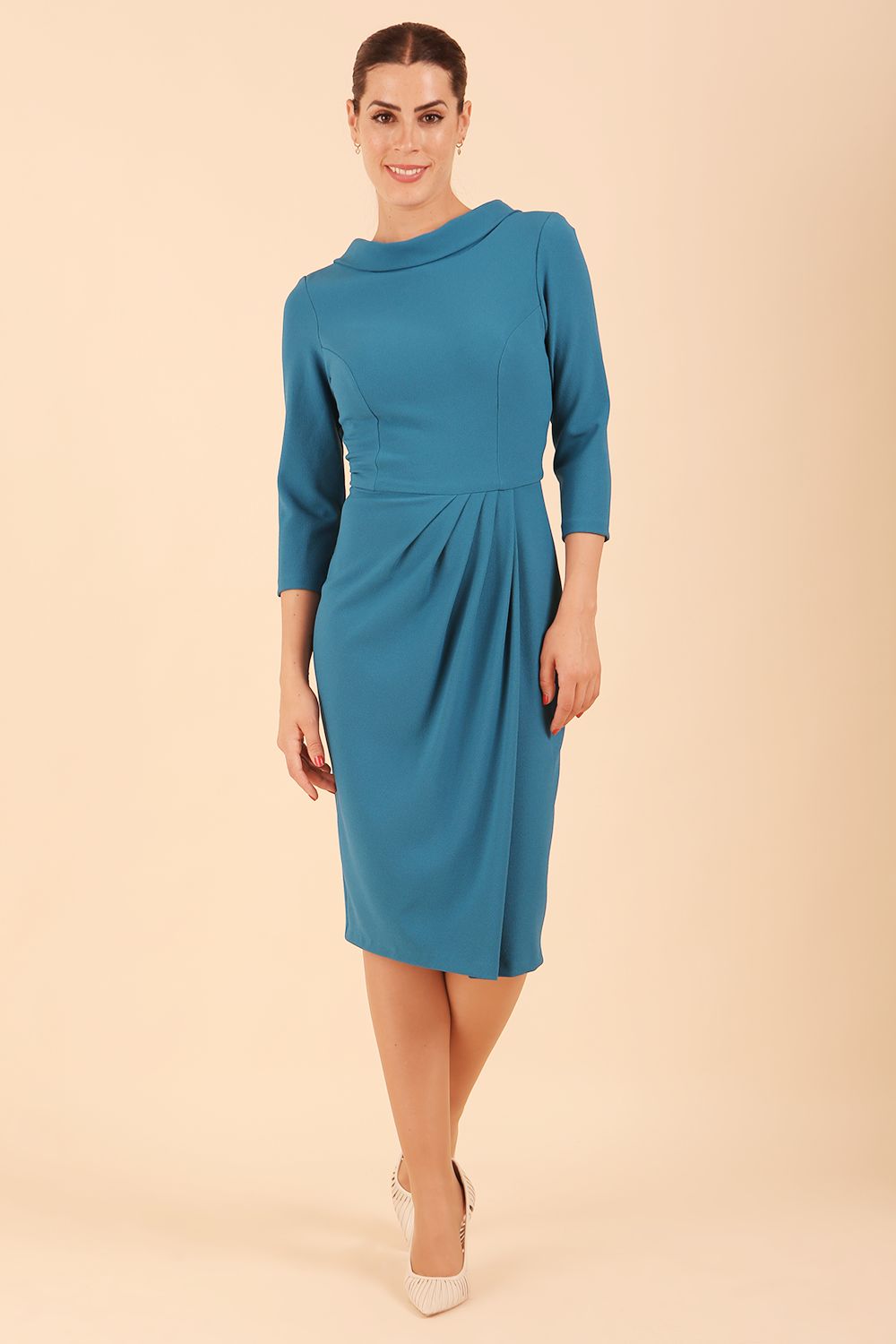 Model wearing diva catwalk Hazel pencil skirt dress with 3/4 sleeved in Tropical Teal front