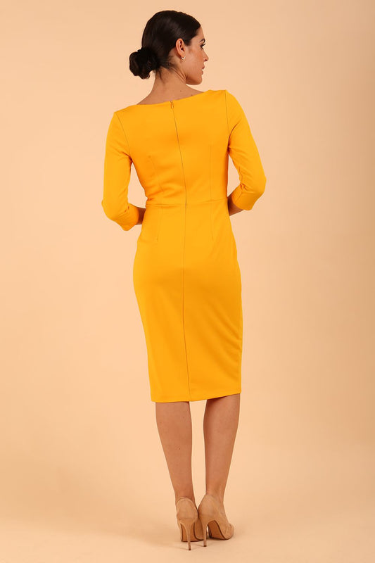 Model wearing diva catwalk Kinga 3/4 Sleeve pencil skirt dress yellow back