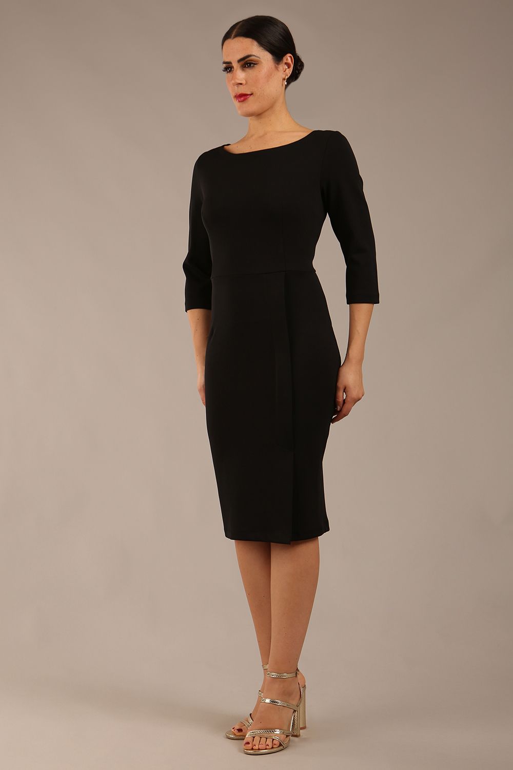 brunette Model wearing a diva catwalk Kinga 3/4 Sleeve pencil skirt dress with round neckline in Black colour front 
