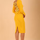 model wearing a diva catwalk Zoey Sleeved Pencil Dress ribbon back with long sleeves and rushed details front and back in Sunshine Yellow colour