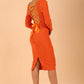 model wearing a diva catwalk Zoey Sleeved Pencil Dress ribbon back with long sleeves and rushed details front and back in Amber Orange colour