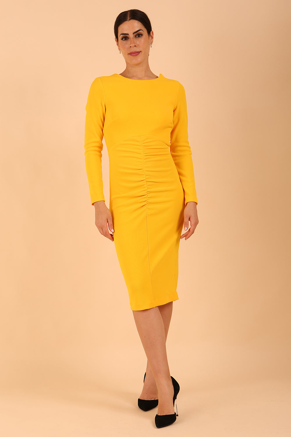 model wearing a diva catwalk Zoey Sleeved Pencil Dress ribbon back with long sleeves and rushed details front and back in Sunshine Yellow colour