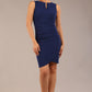Brunette model is wearing a diva catwalk Lydia Sleeveless Mini Dress round neckline wrap style in navy blue colour front  image 