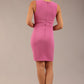 Brunette model is wearing a diva catwalk Lydia Sleeveless Mini Dress round neckline wrap style in begonia pink colour back image