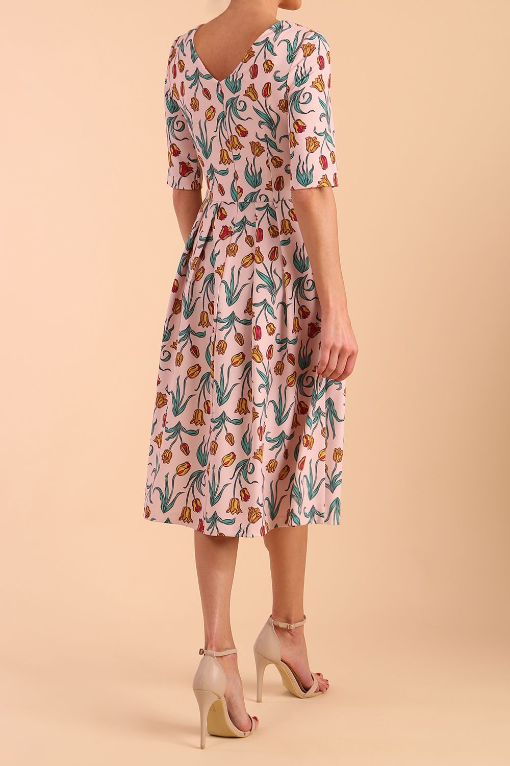 Model wearing diva catwalk Madison Swing Skirt Print Dress in Linear Tulip back