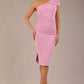 A Brunette Model is wearing a diva catwalk Phoebe One Shoulder Pencil Dress in knee length side vent - dawn pink front