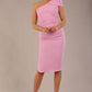 A Brunette Model is wearing a diva catwalk Phoebe One Shoulder Pencil Dress in knee length side vent - dawn pink front