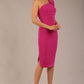 A Brunette Model is wearing a diva catwalk Phoebe One Shoulder Pencil Dress in knee length side vent - magenta front