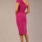 A Brunette Model is wearing a diva catwalk Phoebe One Shoulder Pencil Dress in knee length side vent - magenta back