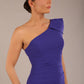 A Brunette Model is wearing a diva catwalk Phoebe One Shoulder Pencil Dress in knee length side vent - spectrum indigo front 