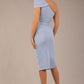 A Brunette Model is wearing a diva catwalk Phoebe One Shoulder Pencil Dress in knee length side vent - powder blue back