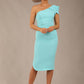 A Brunette Model is wearing a diva catwalk Phoebe One Shoulder Pencil Dress in knee length side vent - turquoise front 