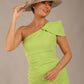 A Brunette Model is wearing a diva catwalk Phoebe One Shoulder Pencil Dress in knee-length side vent with a hat- Lime green front
