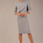 brunette model is wearing a diva catwalk Frieth Gathered Shoulder Dress 3/4 sleeves knee length with shoulder detail in dove grey colour front image