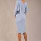 brunette model is wearing a diva catwalk Frieth Gathered Shoulder Dress 3/4 sleeves knee length with shoulder detail in powder blue colour back image